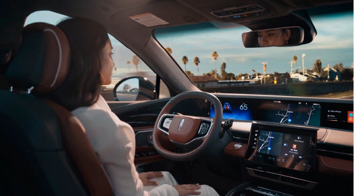 A person is shown driving hands-free on the highway with available Lincoln BlueCruise technology. | Vance Lincoln in Miami OK