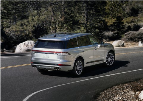 A Lincoln Aviator® is being driven on a winding road | Vance Lincoln in Miami OK