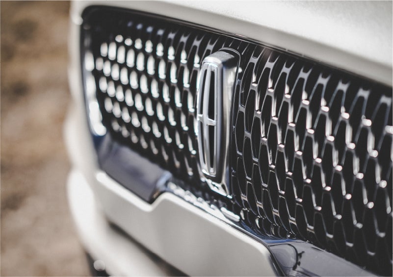 The grille of the 2023 Lincoln Aviator® Reserve model with an eye-catching repeated field of Lincoln Star logo shapes | Vance Lincoln in Miami OK