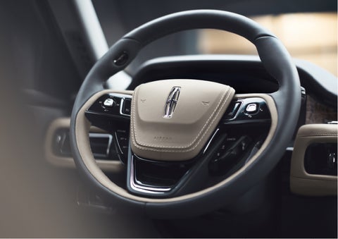 The intuitively placed controls of the steering wheel on a 2023 Lincoln Aviator® SUV | Vance Lincoln in Miami OK