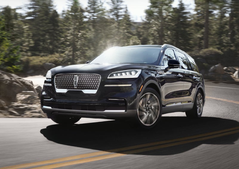 A Lincoln Aviator® SUV is being driven on a winding mountain road | Vance Lincoln in Miami OK