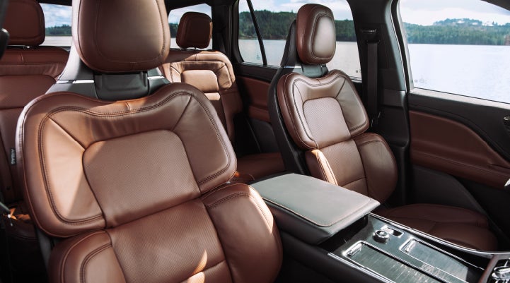 The front row's Perfect Position Seats in a 2024 Lincoln Aviator® Reserve model with Ebony Roast interior | Vance Lincoln in Miami OK