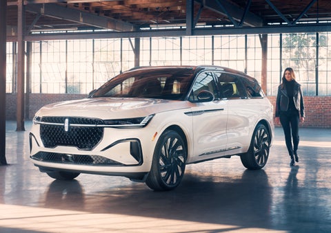 A person approaches a 2024 Lincoln Nautilus® SUV. | Vance Lincoln in Miami OK