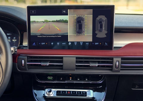 The driver of a 2024 Lincoln Corsair® SUV is shown selecting the drive mode. | Vance Lincoln in Miami OK