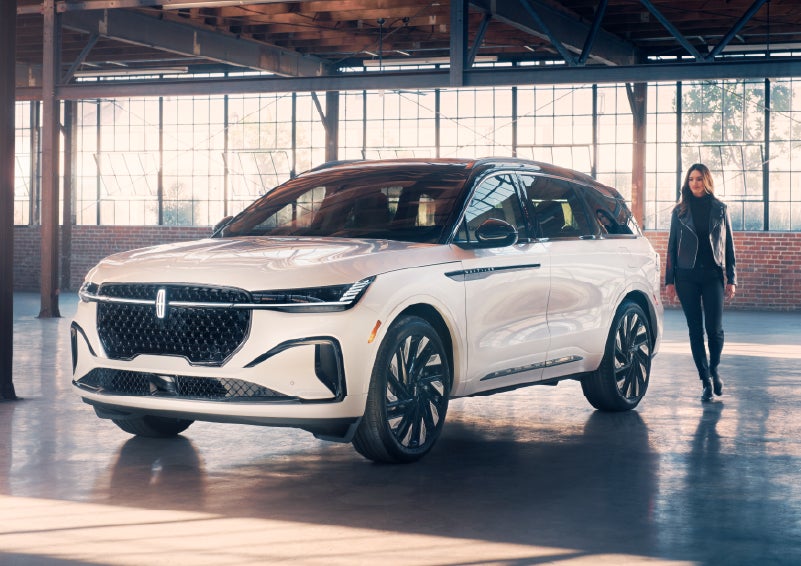 A person approaches a 2025 Lincoln Nautilus® SUV. | Vance Lincoln in Miami OK