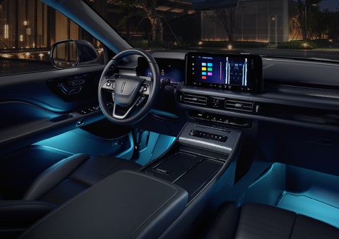 Deep blue Ambient Lighting glows from various places within a 2026 Lincoln Aviator® SUV. | Vance Lincoln in Miami OK