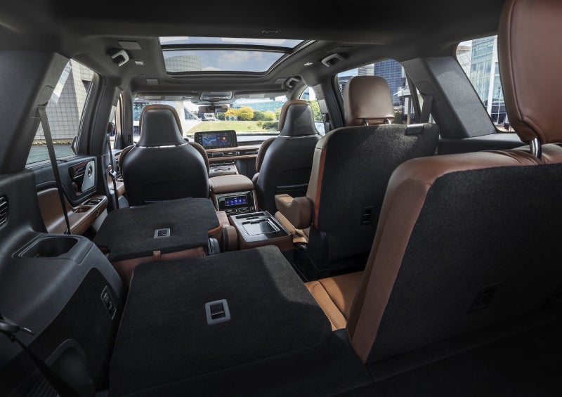 One side of the PowerFold® third-row seat and a second-row seat are folded forward in the 2026 Lincoln Aviator® SUV. | Vance Lincoln in Miami OK