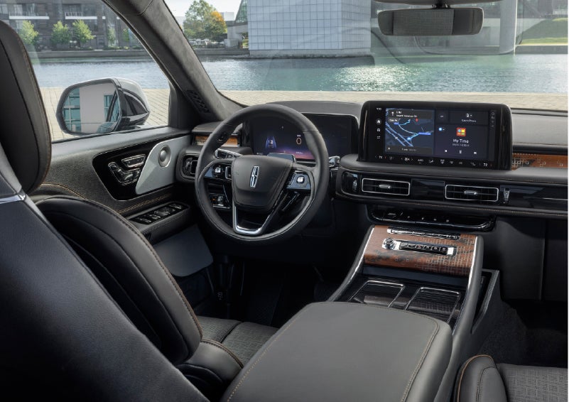 The interior of the 2026 Lincoln Aviator® SUV is shown parked with a view of a harbor through the windshield. | Vance Lincoln in Miami OK