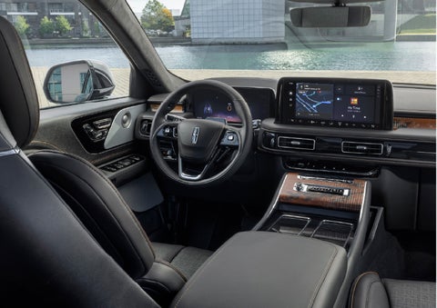 The interior of the 2026 Lincoln Aviator® SUV is shown parked with a view of a harbor through the windshield. | Vance Lincoln in Miami OK
