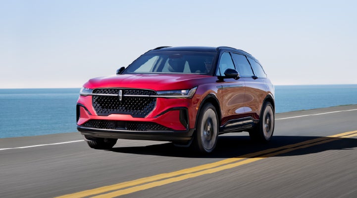 A 2026 Lincoln Nautilus® SUV is being driven on a seaside roadway. | Vance Lincoln in Miami OK