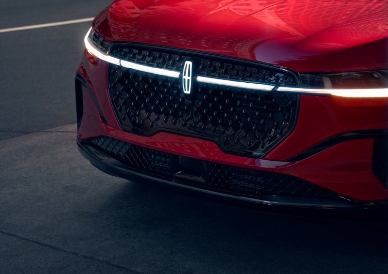 The available front LED light bar and center Lincoln Star logo glow at dusk. | Vance Lincoln in Miami OK