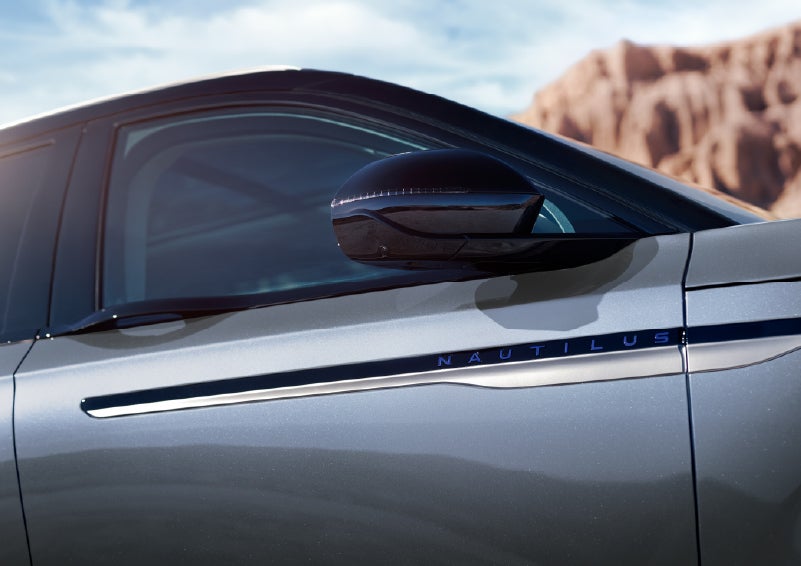 Blue lettering on the side of the vehicle that reads Nautilus indicates the available Hybrid Powertrain. | Vance Lincoln in Miami OK