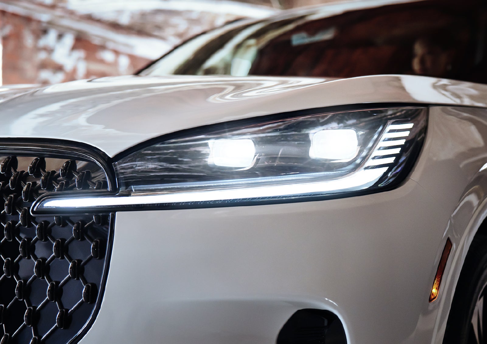 A close-up of a headlamp on the 2027 Lincoln Aviator® SUV is shown. | Vance Lincoln in Miami OK