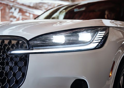A close-up of a headlamp on the 2027 Lincoln Aviator® SUV is shown. | Vance Lincoln in Miami OK