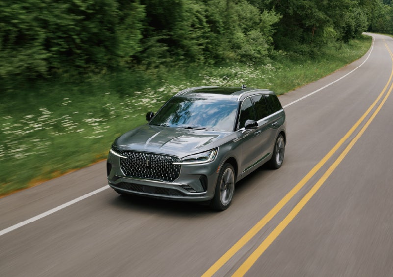 A 2027 Lincoln Aviator® SUV is being driven down a road. | Vance Lincoln in Miami OK